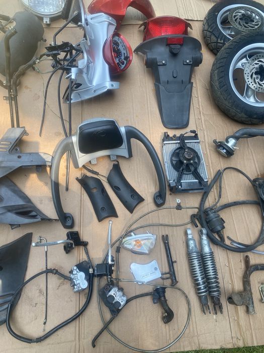 Kymco Grandink 125 owiewka licznik lampa koło zacisk amortyzator bak