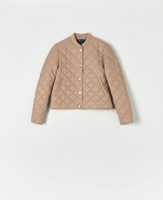 Стьобана куртка в новому стані