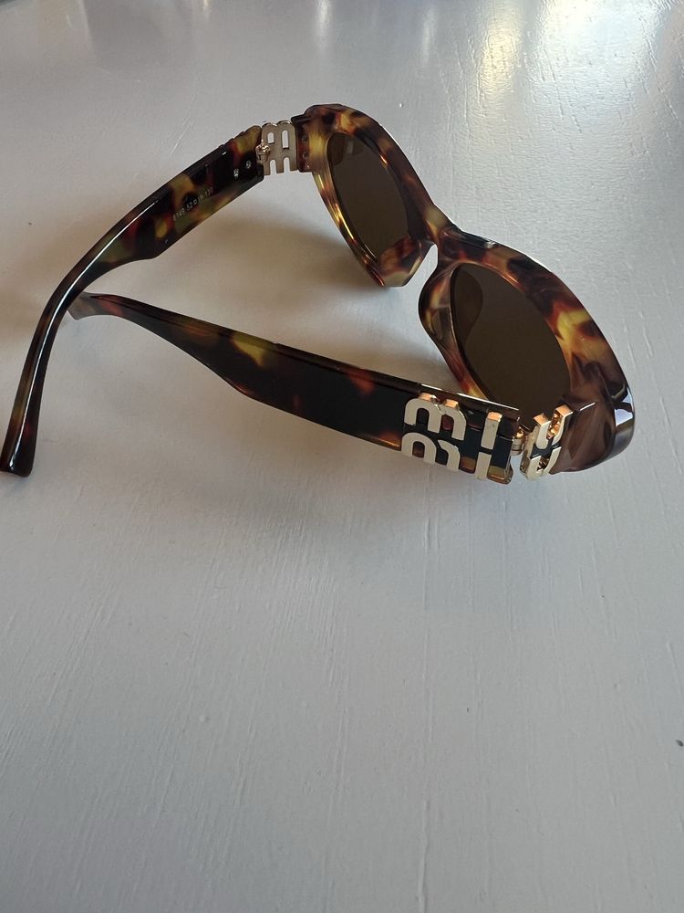Óculos Sol Miu Miu