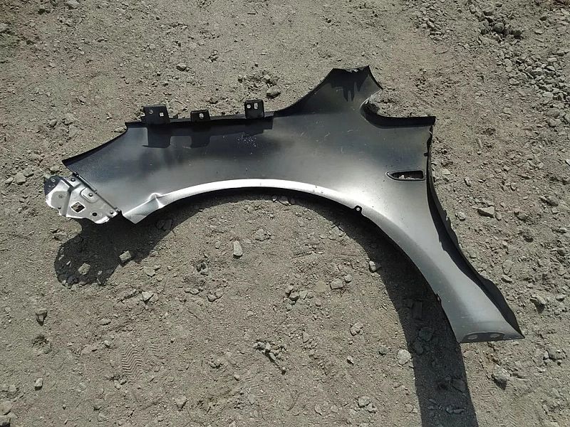 Błotnik prawy przedni Opel Astra J IV