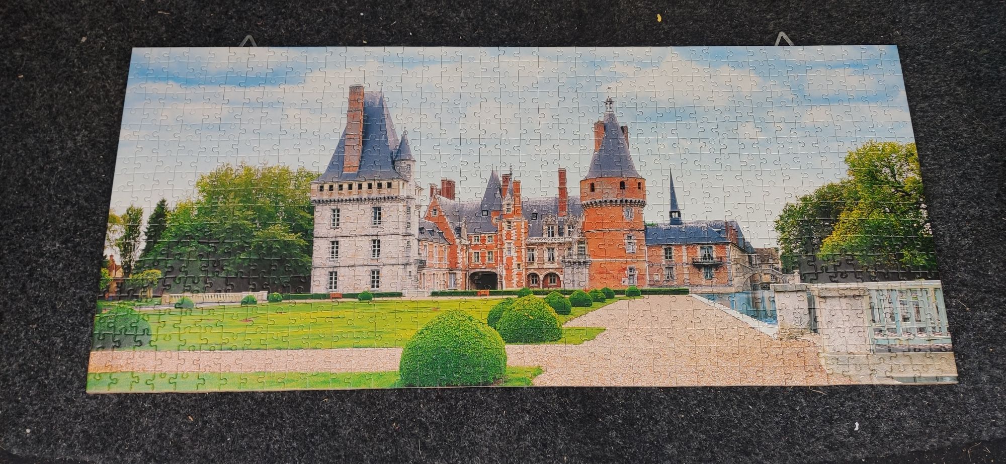 Puzzle obrazek zamek pałac ułożone na desce 70x30 cm