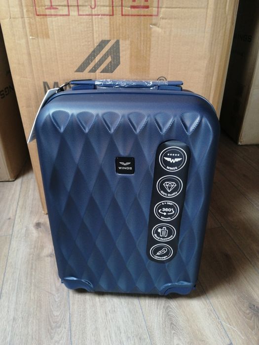 Валіза Чемодан Wings  на 4 колесах полікарбонова