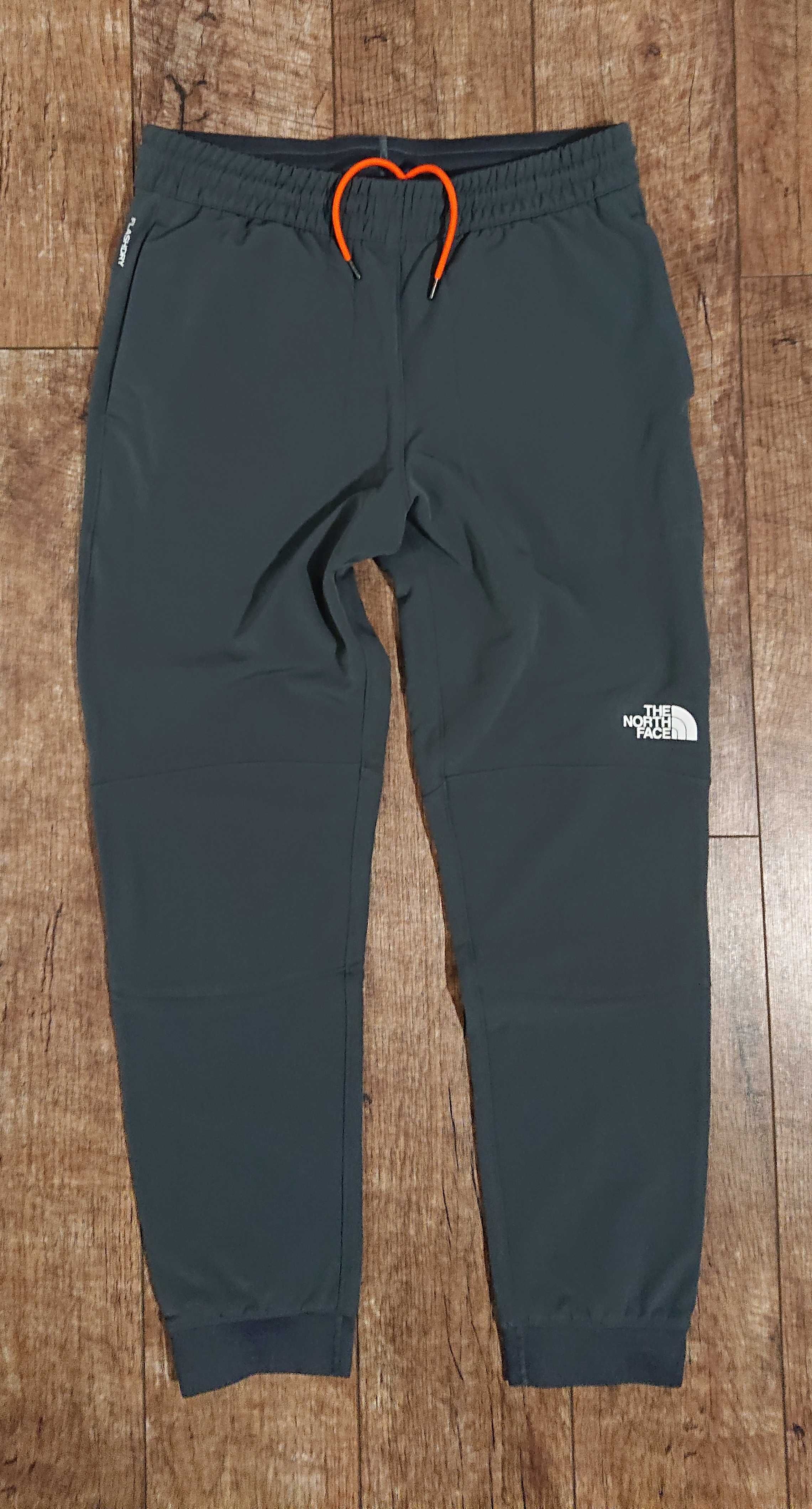 39. The North Face - Tekware - Szare Polarowe Spodnie Joggersy. Nowe
