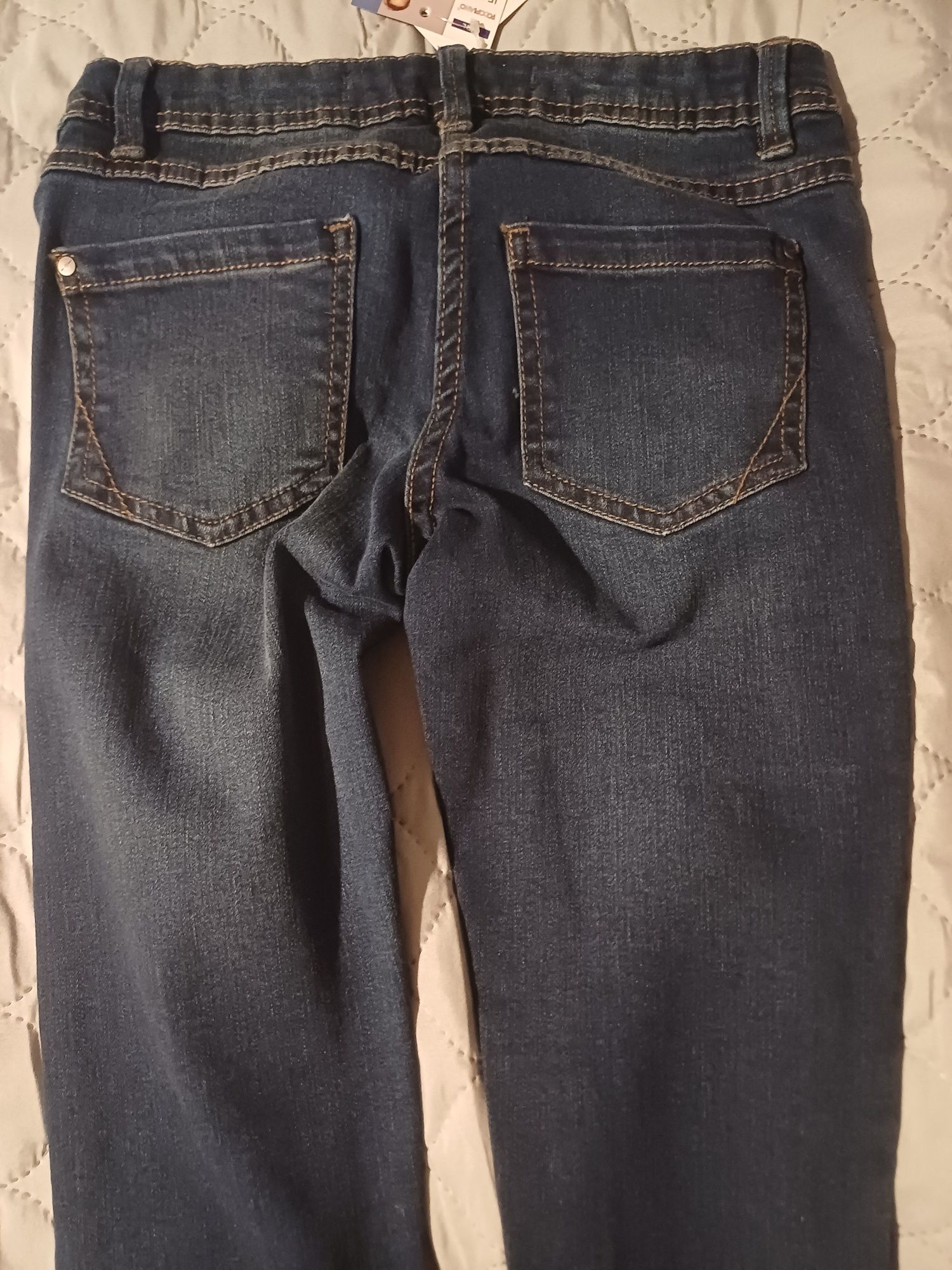 Nowe spodnie dżinsowe dziewczęce 128 granatowe