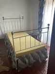 Cama de ferro de solteiro