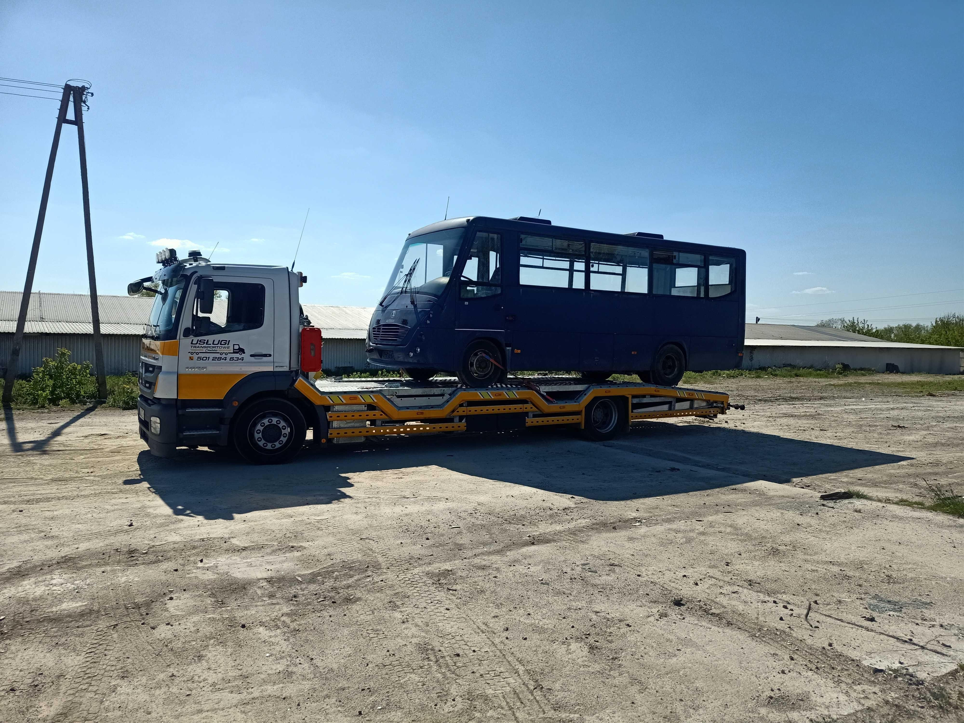 Pomoc drogowa transport maszyn  laweta autolaweta usługi transportowe