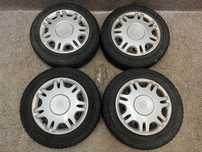 Kola felgi opony ZIMA kolpaki nakretki R14 4x100 5.5J ET49 Toyota Yaris I
