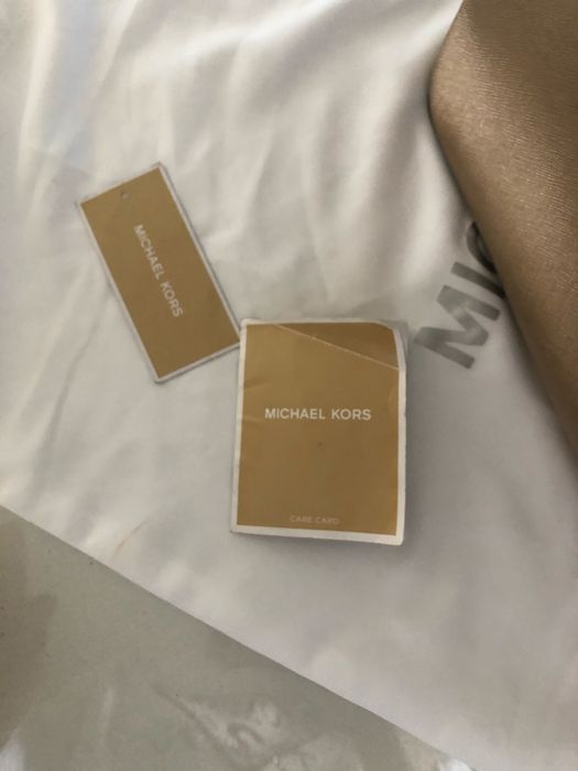 Mala michael kors dourada