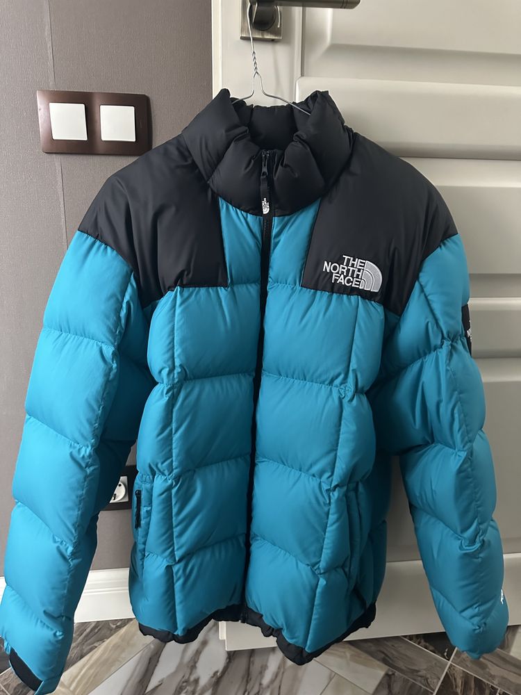 The North Face пуховик синий