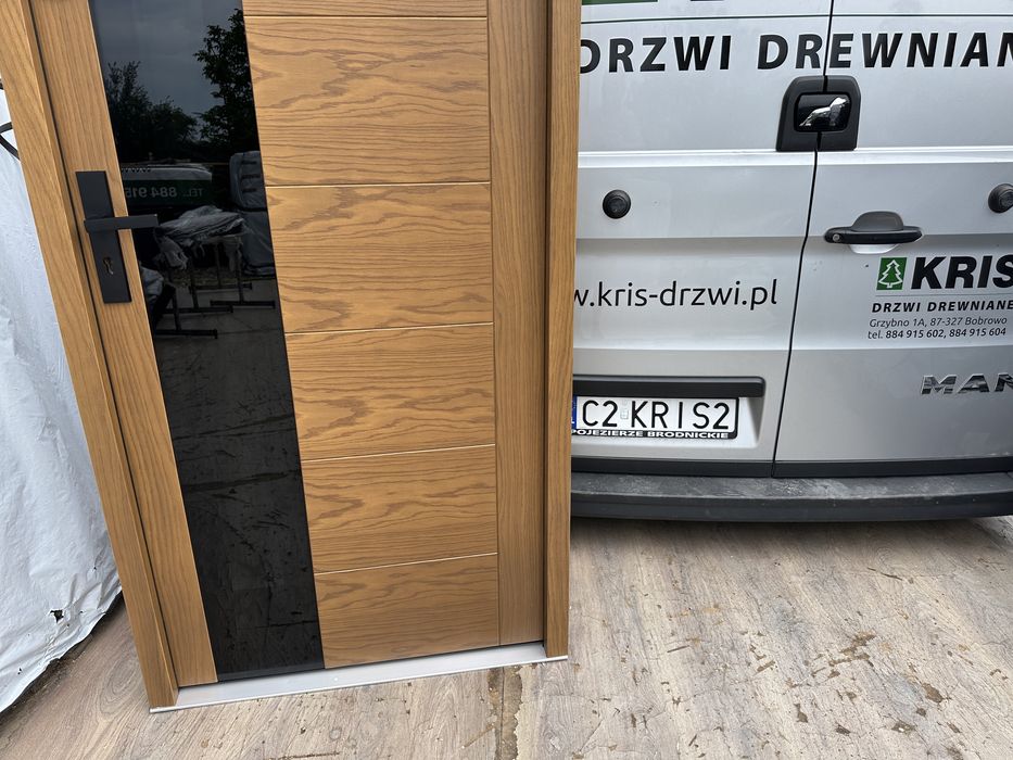 Drzwi zewnetrzne drewniane Montaż Cała Polska dębowe czarna szyba