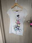 Kremowy t-shirt z nadrukiem ekspres Reserved