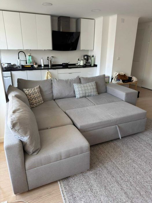 Sofá-cama cinzento de canto com chaise longue