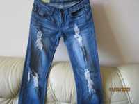 Spodnie jeansy damskie poprzecierane -pas 38cm
