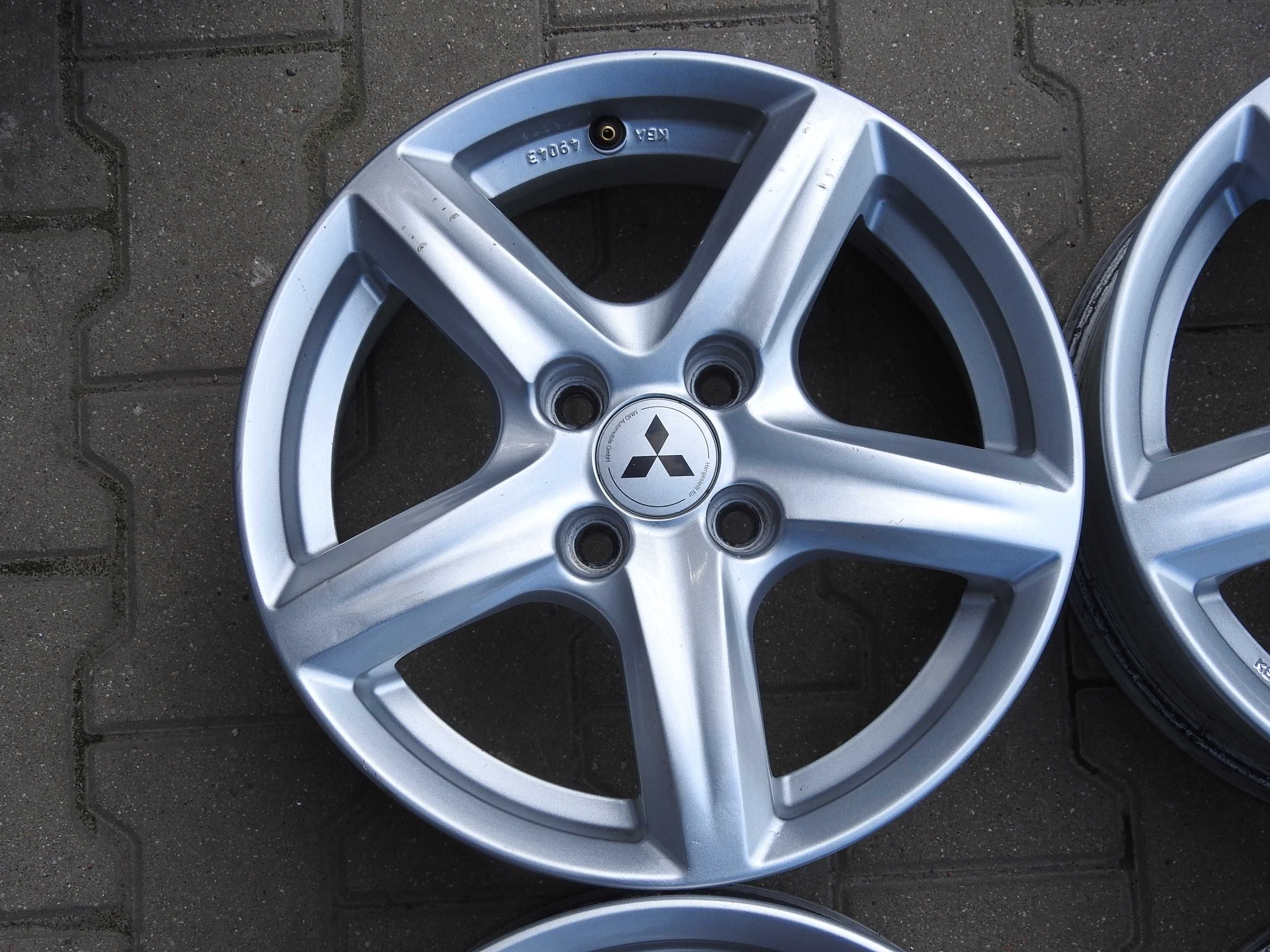 4x Alu 15'' 4x100 6J ET42 Piasta 56,1mm MITSUBISHI z czujnikami TPMS