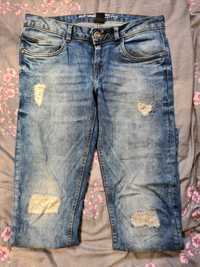 Damskie jeansy z rozdarciami