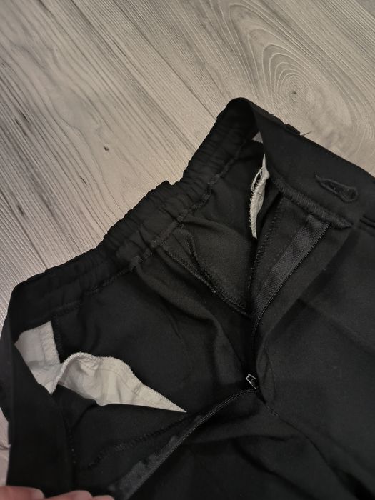 Materiałowe spodnie eleganckie dla chłopca rozmiar 140/146