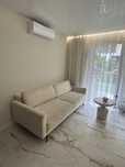 Sofa boucle z pojemnikiem