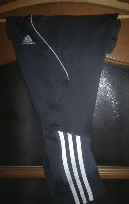 Sportowe treningowe rybaczki krótkie spodenki spodnie dresowe Nike 4F