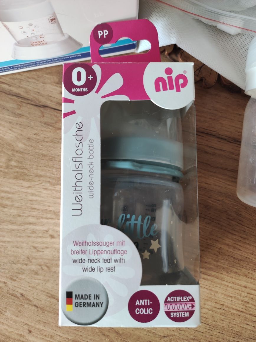 Молоковідсмоктувач Canpol +пляшечка Nip