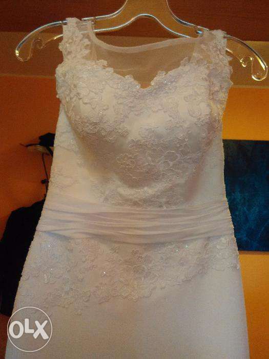 Suknia ślubna z odkrytymi plecami - bardzo modny fason gratis żakiet