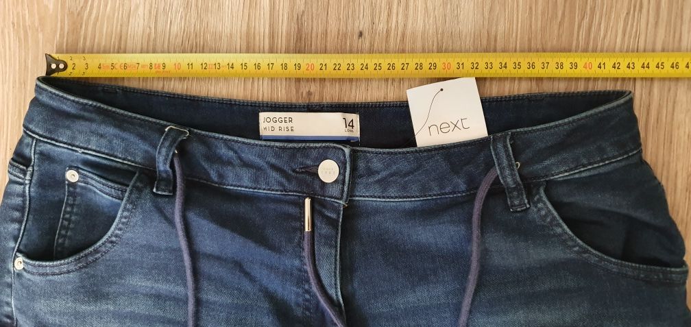 Nowe spodnie NEXT  joggery rozmiar L 42 kolor granatowy