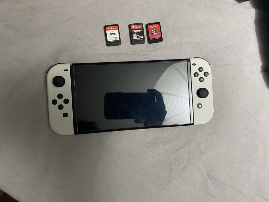 Nintendo switch Oled nova com 3 jogos fisicos