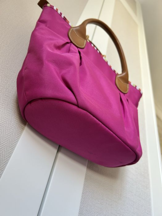 Mala de mão fúcsia