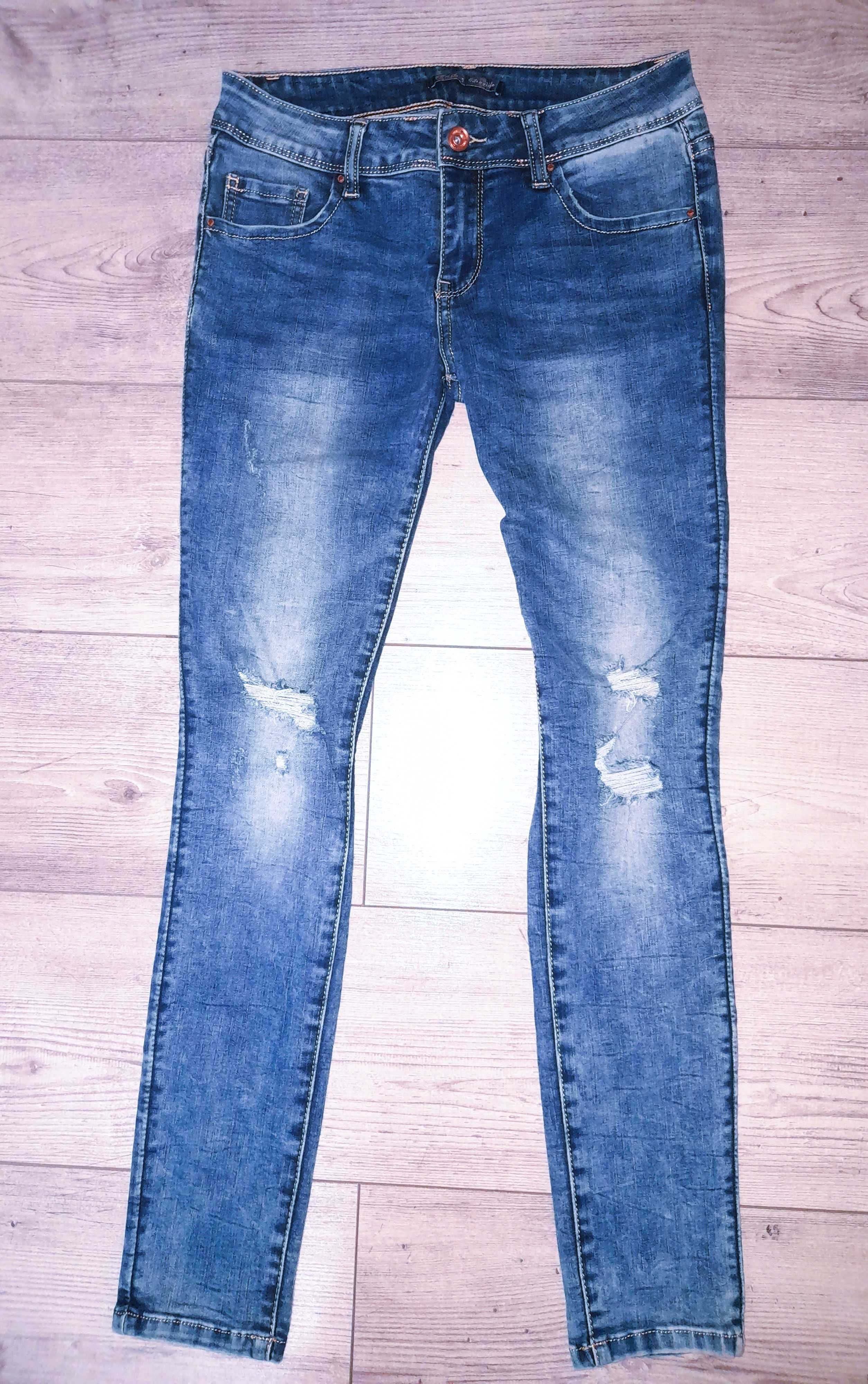 Cieniowane jeansy z dziurami rozm.M