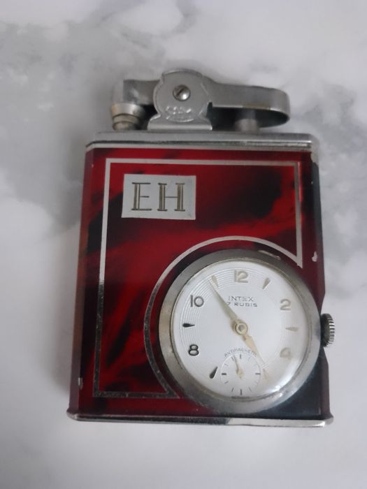 zabytkowa zapalniczka zegarkiem benzynowa