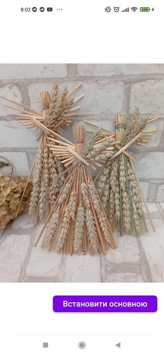 Ангел різдвяний з соломи прикрашений колоссям