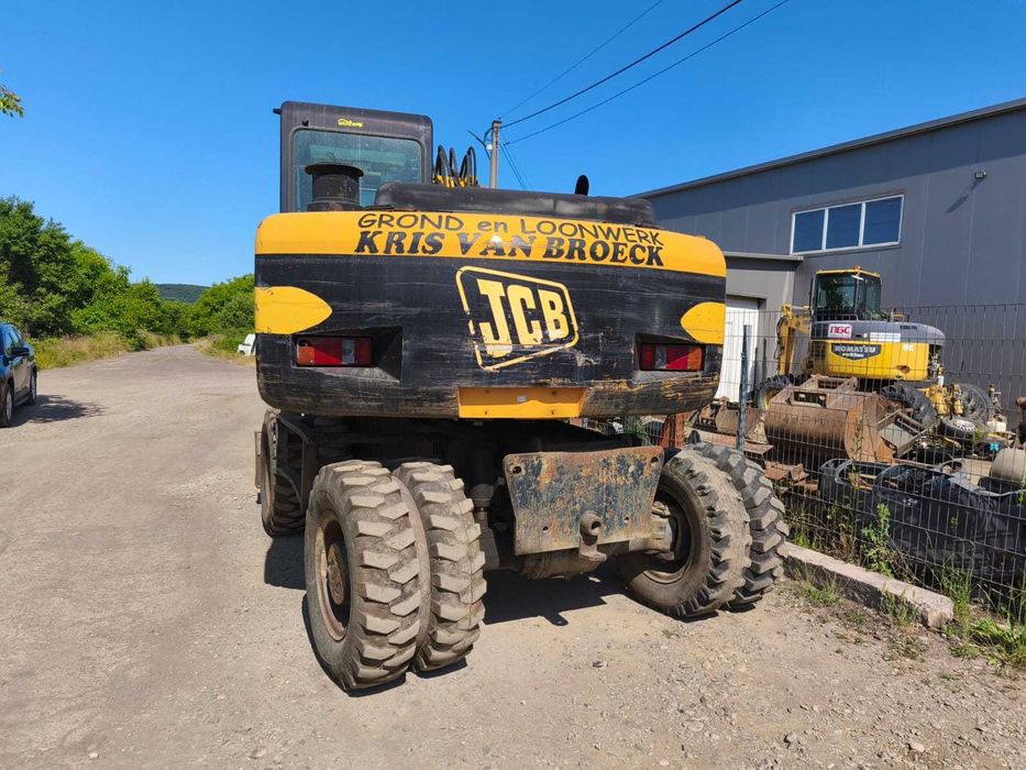 Колісний екскаватор повноповоротний екскаватор JCB JS145 2002року