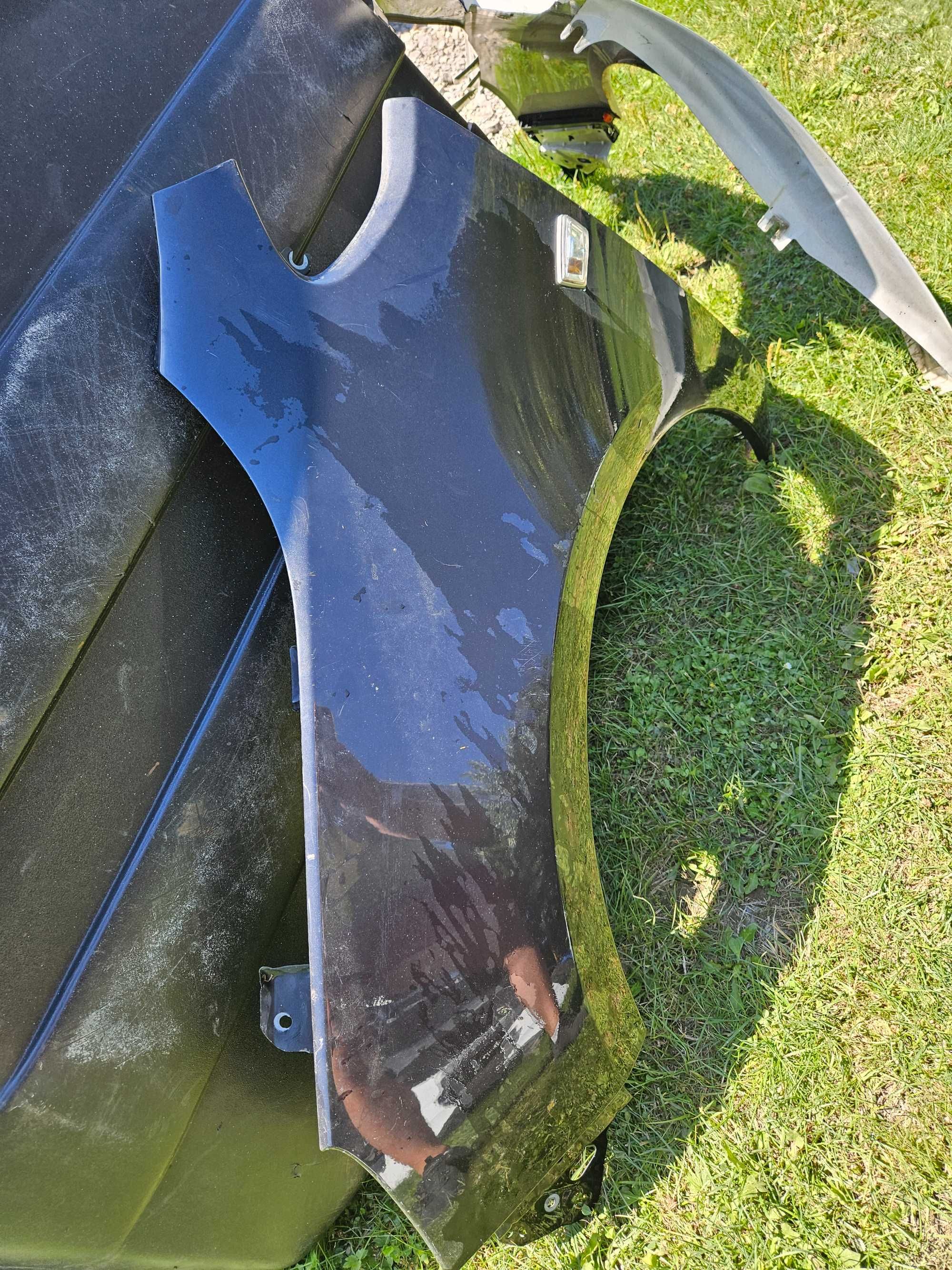 Błotnik Przedni Opel Astra J