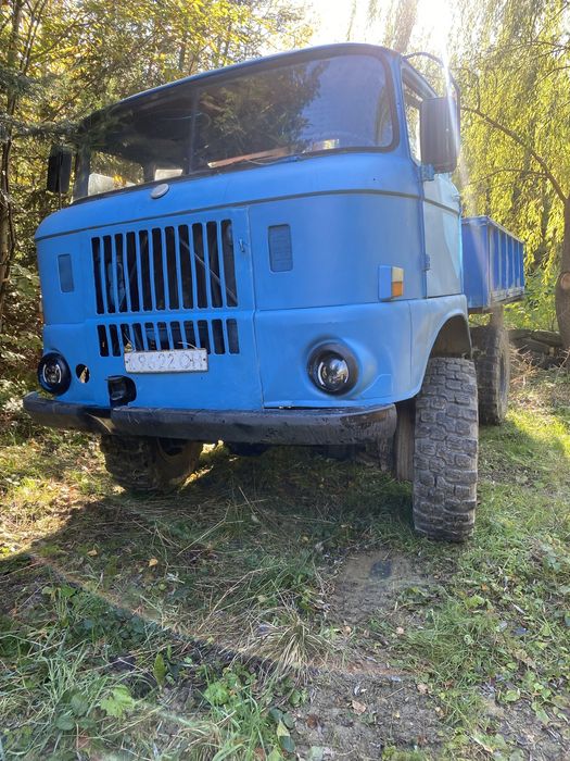 Повно привідна з маніпулятором самосвал на три сторони