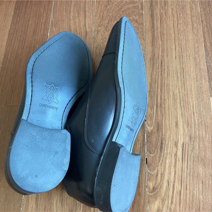 Sapatos elegantes de homem