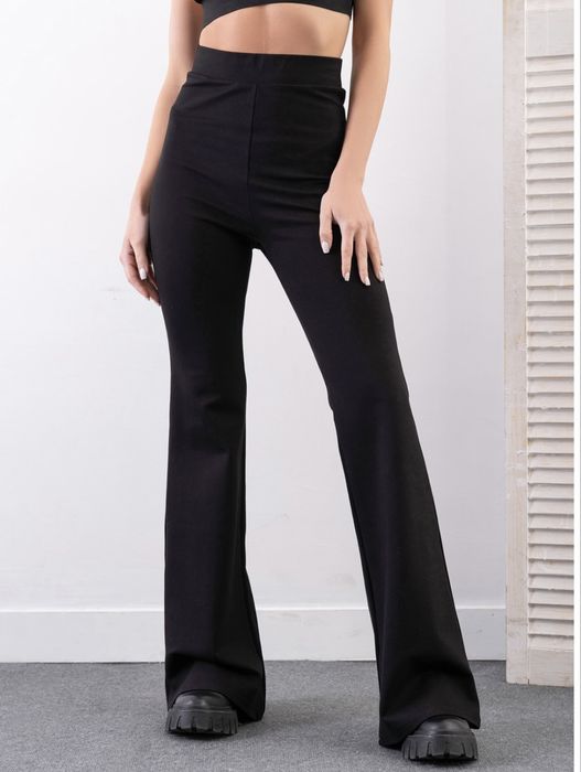 Штани кльош від коліна