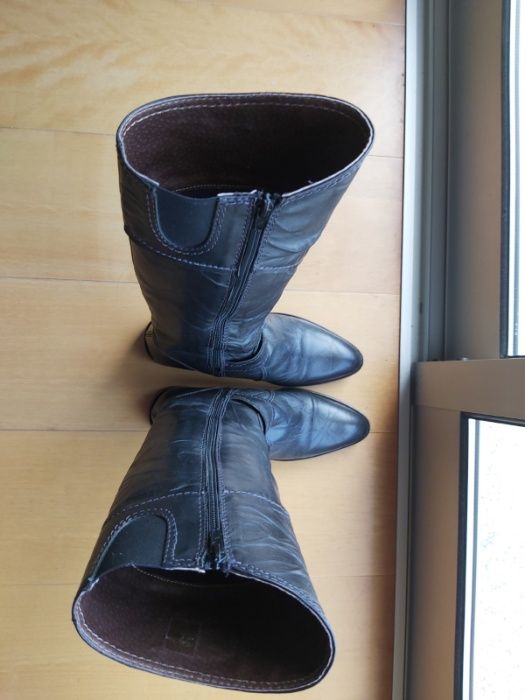Botas cano alto Em Pele