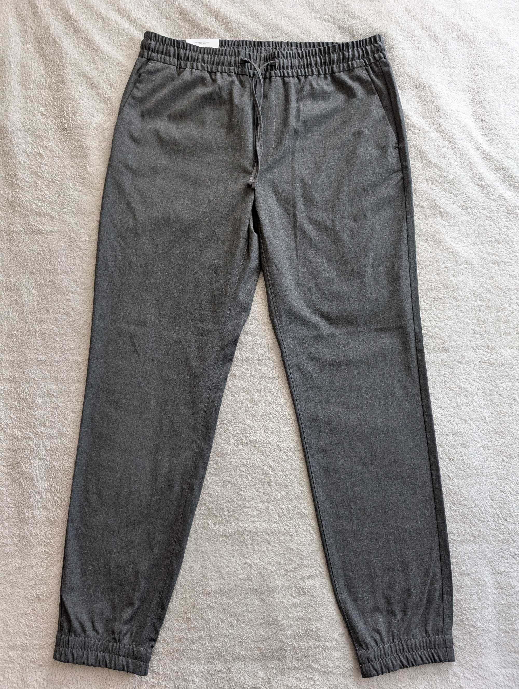 Nowe szare eleganckie spodnie joggery na gumie Burton Slim 34 R