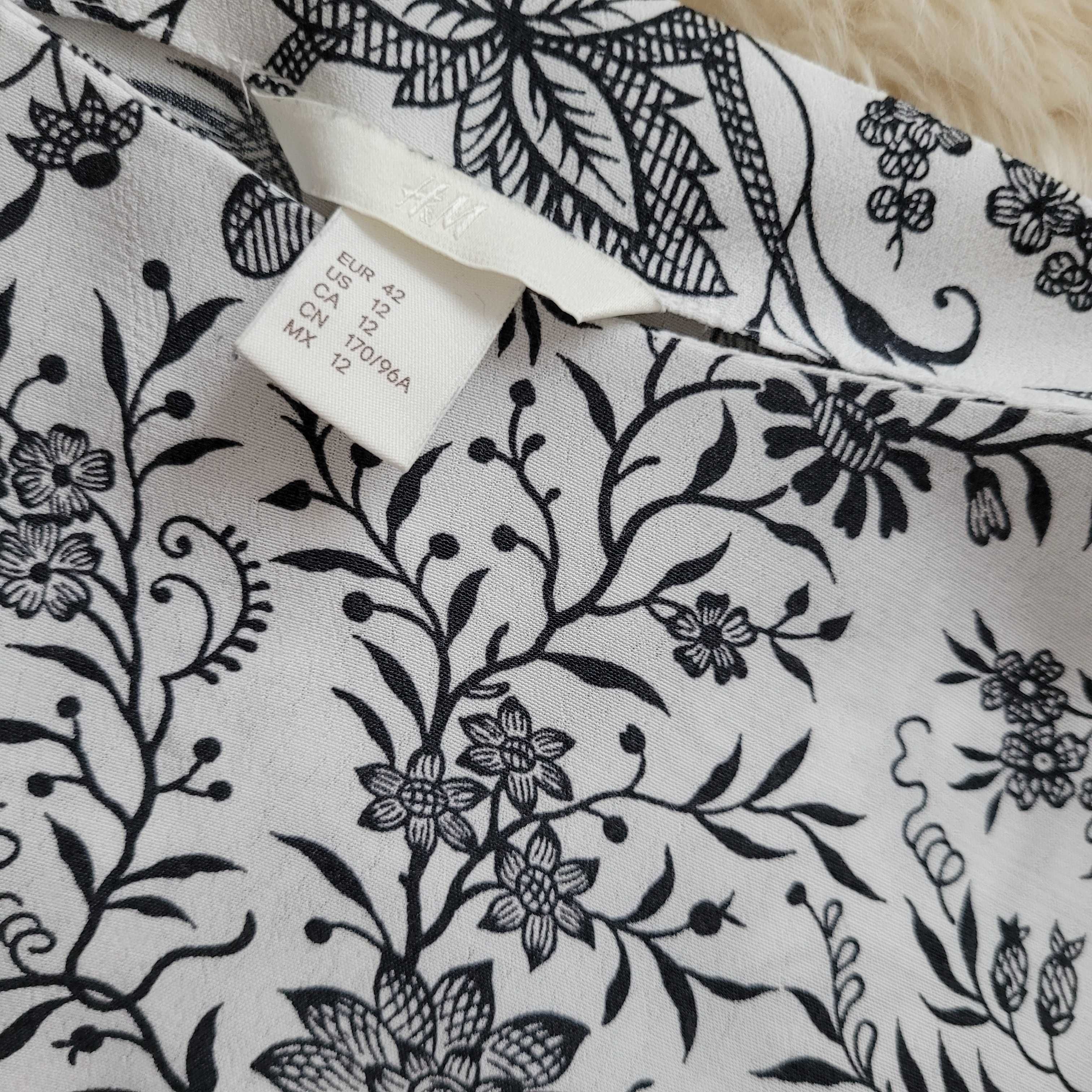 H&M bluzka w kwiatuszki rozkloszowane rękawy roz. 42 - L / XL jak NOWA