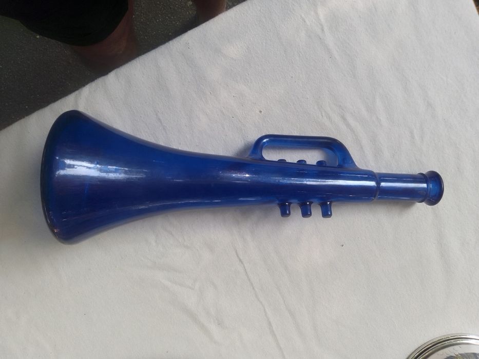 Navy blue trumpet-shaped bottle.64284843763074120