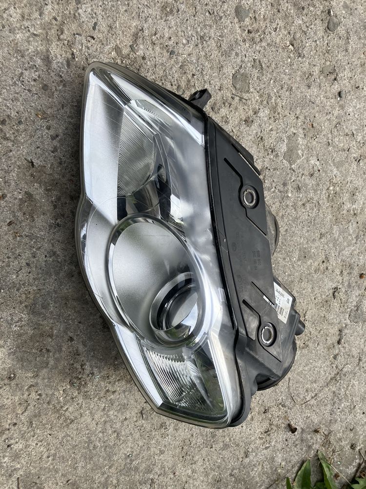 Lampa lewa VW Passat B6 hella