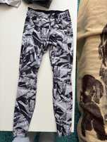 Stylowe damskie leginsy czarno-biale Domyos