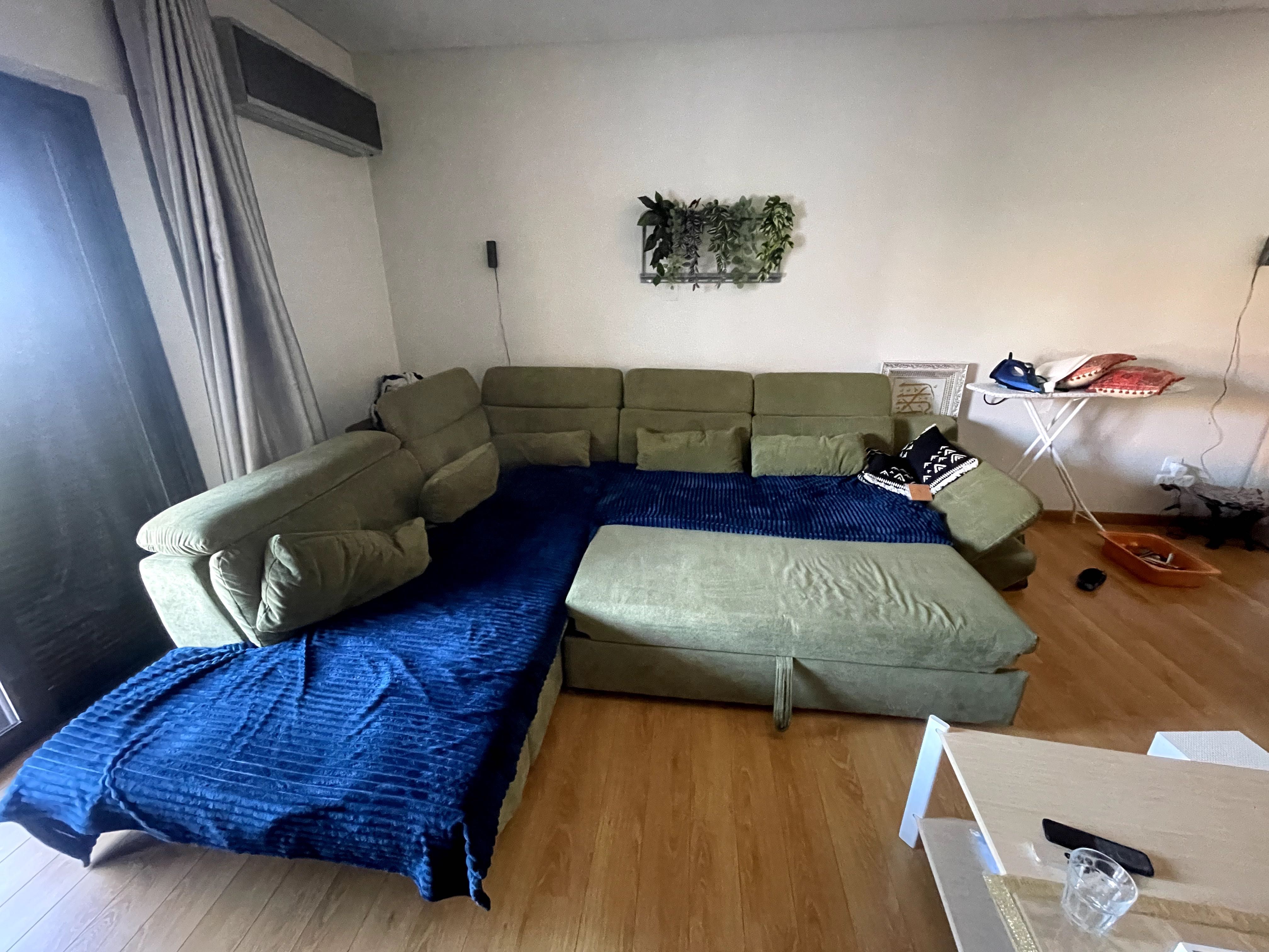 Green sofa with extension