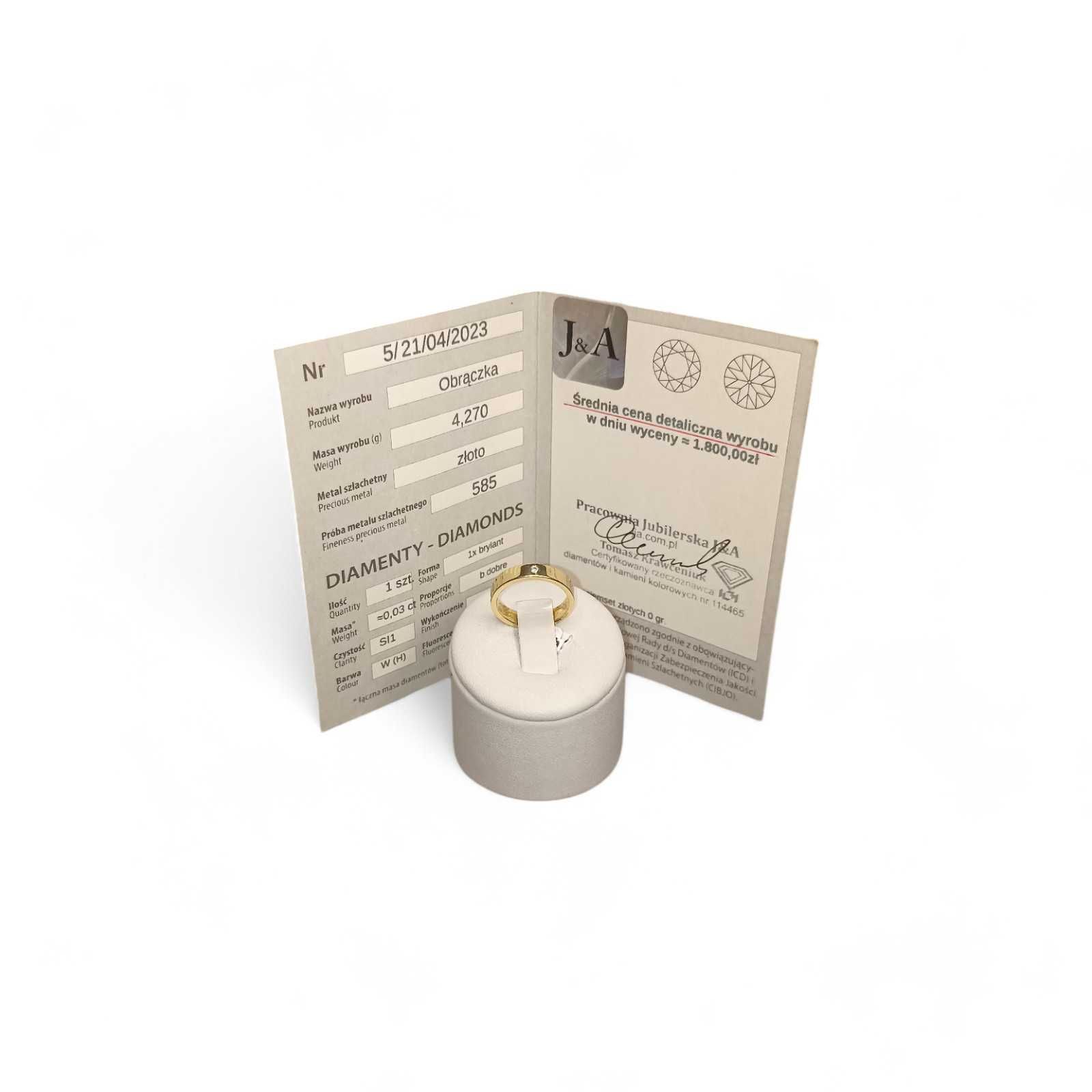 Złota obrączka z diamentem, 0,03ct. pr. 585, 4,27g. roz. 12