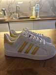 Adidas superstar złote paski