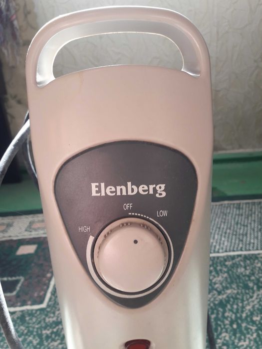 Обігрівач масляний "Еленберг" у робочому стані. Потужність 800Вт.