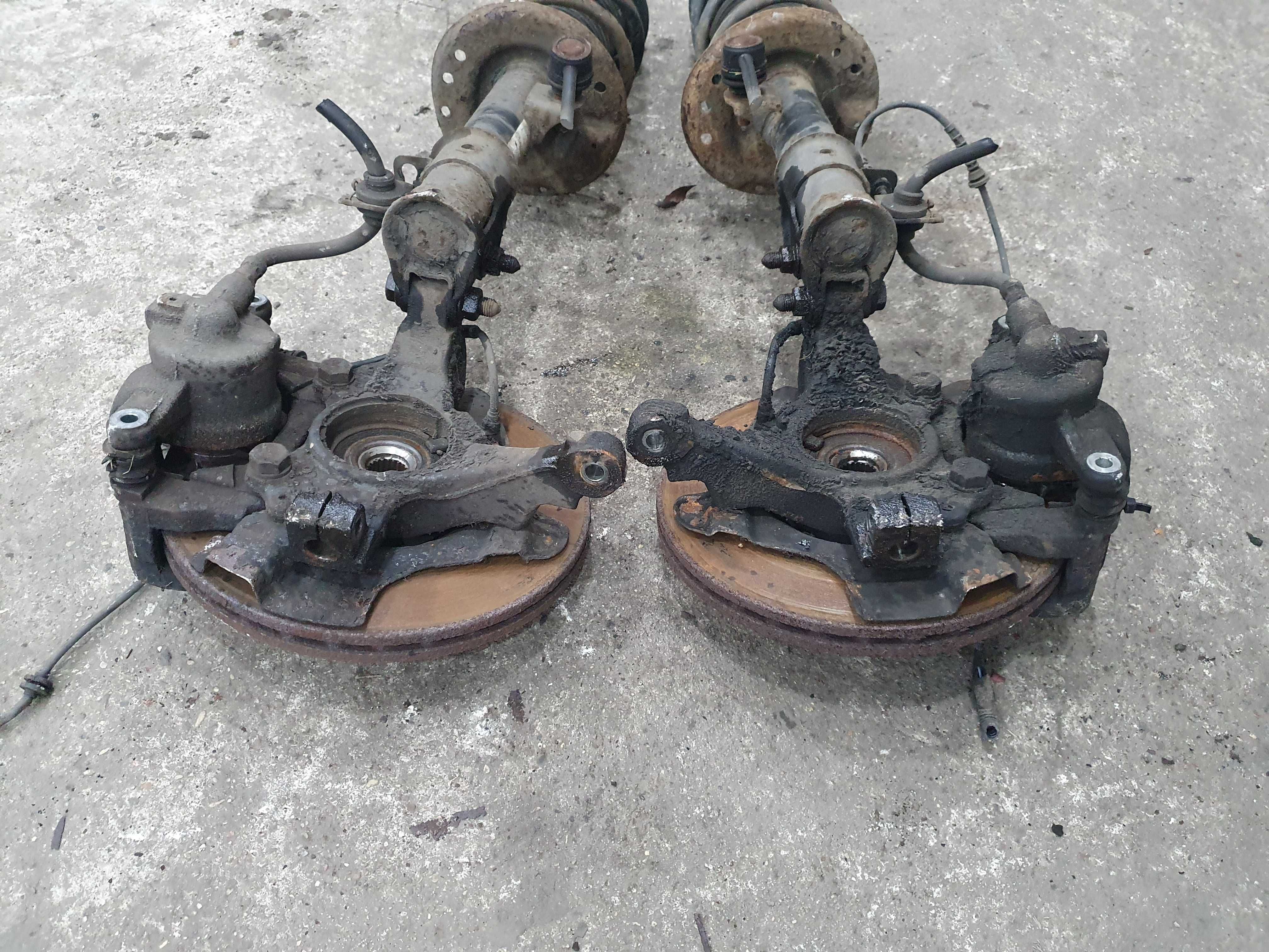 Amortyzator piasta zwrotnica zacisk sprezyna Opel Corsa D 1.2