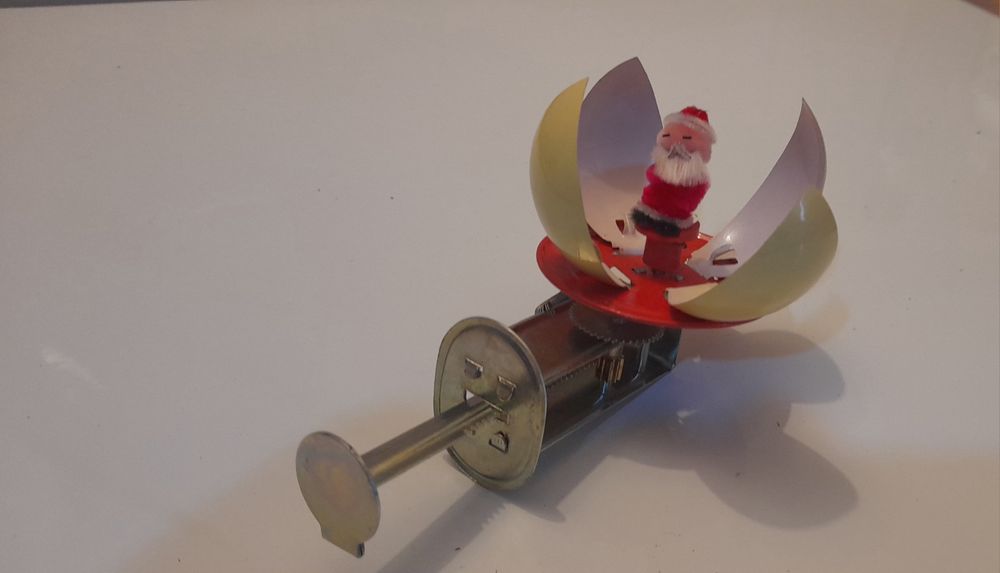 Brinquedo de lata mecânico pai natal com caixa
