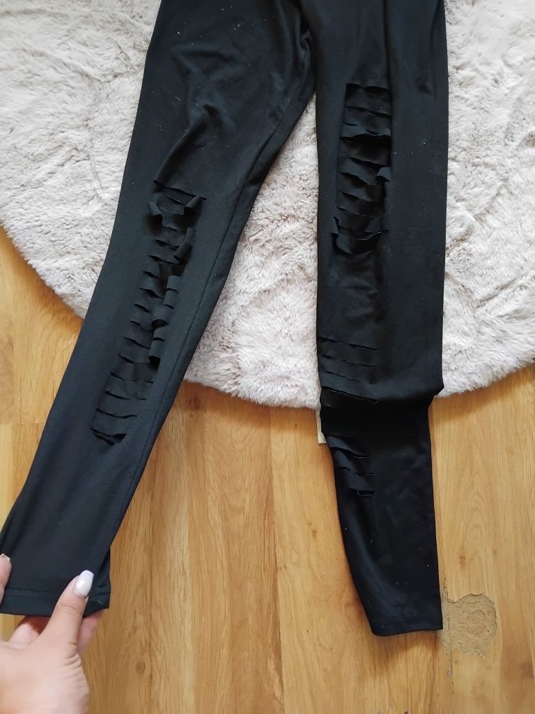 Czarne spodnie legginsy rozcięcia dziurawe M 38