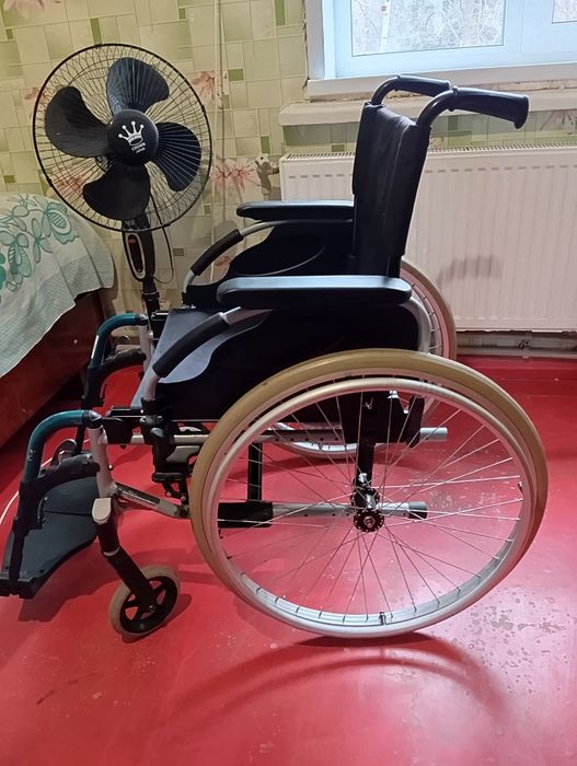 Инвалидная коляска .