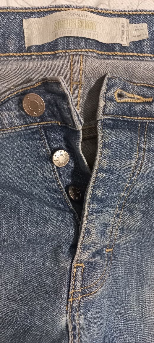 Jasnoniebieskie wytarte damskie jeansy dżinsy spodnie na guziki L XL